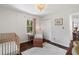 Neutral Bedroom with a wood crib, white walls, and hardwood floors at 5725 Brenda Sw Dr, Mableton, GA 30126