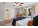 Bedroom with two windows, a ceiling fan, and neutral decor at 5725 Brenda Sw Dr, Mableton, GA 30126