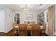 Charming dining room with wood floors, table, and natural light at 5725 Brenda Sw Dr, Mableton, GA 30126