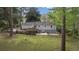 Home with a large backyard, deck, and mature trees offering privacy at 5725 Brenda Sw Dr, Mableton, GA 30126