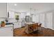 Well-lit kitchen with white cabinets, stainless steel appliances, and a unique wooden island at 5725 Brenda Sw Dr, Mableton, GA 30126