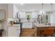 Bright kitchen with white cabinets, granite counters, and stainless steel appliances at 5725 Brenda Sw Dr, Mableton, GA 30126