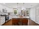 Modern kitchen with white cabinets, granite countertops, a rustic wood island, and stainless steel appliances at 5725 Brenda Sw Dr, Mableton, GA 30126