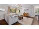 Comfortable living room showcasing hardwood floors, a large sectional, and stylish decor at 5725 Brenda Sw Dr, Mableton, GA 30126