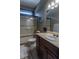 Cozy bathroom featuring a shower/tub combination, dark wood vanity, and neutral decor at 100 Trotters Ridge, Fayetteville, GA 30215