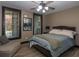 Comfortable bedroom with hardwood floors, neutral walls, and a cozy seating area at 100 Trotters Ridge, Fayetteville, GA 30215