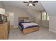 Cozy bedroom with plush carpeting, a wood-frame bed, and natural light at 100 Trotters Ridge, Fayetteville, GA 30215