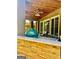 Outdoor kitchen with a built-in grill, stone countertops, and a covered ceiling for stylish outdoor dining at 100 Trotters Ridge, Fayetteville, GA 30215