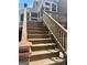 Wooden stairs leading to the entrance with stylish railings and a welcoming ambiance at 100 Trotters Ridge, Fayetteville, GA 30215