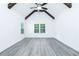 Bright bedroom with vaulted ceiling, wood beams, natural light from large windows, and neutral color palette at 2109 Ella Springs Dr, Covington, GA 30014