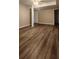Open basement area features wood look flooring, with neutral paint and entry door at 2663 Washington Nw St, Atlanta, GA 30318