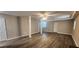 Spacious finished basement with windows and walkout doors and wood look floors at 2663 Washington Nw St, Atlanta, GA 30318