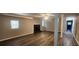 Finished basement with fireplace, wood-look floors, windows, and neutral walls at 2663 Washington Nw St, Atlanta, GA 30318