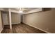Open basement area features wood look flooring, with neutral paint and entry door at 2663 Washington Nw St, Atlanta, GA 30318