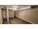 Open basement area features wood look flooring, with neutral paint and entry door at 2663 Washington Nw St, Atlanta, GA 30318