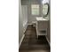 Bathroom with a white vanity, matching toilet and shower/bath and window at 2663 Washington Nw St, Atlanta, GA 30318