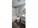 Bright bathroom featuring white vanity, round mirror, and modern fixtures, alongside a tub and shower combination at 2663 Washington Nw St, Atlanta, GA 30318