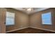 Bedroom with hardwood floors, a ceiling fan and two windows at 2663 Washington Nw St, Atlanta, GA 30318