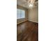 Bright bedroom featuring beautiful dark wood floors and a ceiling fan light at 2663 Washington Nw St, Atlanta, GA 30318