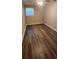 Cozy bedroom with natural light, wood look floors, and a ceiling fan for comfort at 2663 Washington Nw St, Atlanta, GA 30318