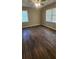 Bedroom with hardwood floors, a ceiling fan and two windows at 2663 Washington Nw St, Atlanta, GA 30318