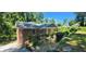 Brick home with a well-manicured yard and mature trees, offering a serene setting at 2663 Washington Nw St, Atlanta, GA 30318