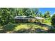 Charming brick home surrounded by mature trees and a well-kept lawn, perfect for suburban living at 2663 Washington Nw St, Atlanta, GA 30318