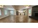 Beautiful, open-concept living area features stainless appliances, hardwood floors, and a cozy brick fireplace at 2663 Washington Nw St, Atlanta, GA 30318