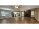 Spacious open-concept living area with modern kitchen, stainless appliances, hardwood floors, and fireplace at 2663 Washington Nw St, Atlanta, GA 30318