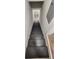 Stairway leading downstairs with painted stairs and walls with trim at 2663 Washington Nw St, Atlanta, GA 30318