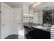 Bathroom vanity with granite countertop and large mirror adjacent to white doors at 2767 Durham Ne Dr, Atlanta, GA 30319
