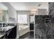 Elegant bathroom with double vanity, soaking tub, and luxurious marble-tiled shower at 2767 Durham Ne Dr, Atlanta, GA 30319