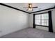 Neutral bedroom with gray carpet, a ceiling fan, and black trimmed windows and trim at 2767 Durham Ne Dr, Atlanta, GA 30319