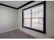 Bedroom showcasing a large window with black trim and views of the neighborhood at 2767 Durham Ne Dr, Atlanta, GA 30319