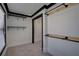 Walk-in closet featuring custom black pipe shelving and natural light at 2767 Durham Ne Dr, Atlanta, GA 30319