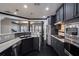 Modern kitchen featuring stainless steel appliances, dark cabinets, and marble countertops at 2767 Durham Ne Dr, Atlanta, GA 30319