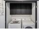 Laundry room featuring front load washer and dryer with black upper cabinets at 2767 Durham Ne Dr, Atlanta, GA 30319