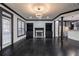 Spacious living room with black trim, fireplace, dark wood floors, and ample lighting at 2767 Durham Ne Dr, Atlanta, GA 30319