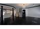 Open living space featuring hardwood floors, modern lighting, and a view of the kitchen at 2767 Durham Ne Dr, Atlanta, GA 30319