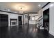 Open-concept living area showcases dark wood floors and access to kitchen, stairs, and lighting at 2767 Durham Ne Dr, Atlanta, GA 30319