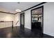 Open-concept living space with hardwood floors, modern lighting, and staircase at 2767 Durham Ne Dr, Atlanta, GA 30319