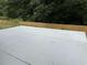 Concrete patio in a fenced backyard with mature trees at 4805 Madison Point Cir, Austell, GA 30106