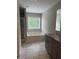 Bathroom with tiled floor, tub under window, granite topped vanity and shower alcove at 4805 Madison Point Cir, Austell, GA 30106