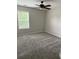 Neutral bedroom with carpet flooring, ceiling fan, and natural light at 4805 Madison Point Cir, Austell, GA 30106