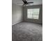 Bedroom with a ceiling fan and a window providing natural light at 4805 Madison Point Cir, Austell, GA 30106