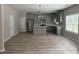 Modern kitchen with stainless steel appliances, an island, and new floors at 4805 Madison Point Cir, Austell, GA 30106