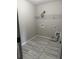 Neat laundry room featuring tile floor and a wire rack for storage at 4805 Madison Point Cir, Austell, GA 30106
