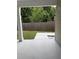Covered patio overlooking fenced yard and green space beyond at 4805 Madison Point Cir, Austell, GA 30106