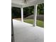 Covered patio with view of fenced backyard and grass at 4805 Madison Point Cir, Austell, GA 30106