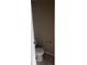 Image showing a clean and simple powder room with a toilet and tile flooring at 4805 Madison Point Cir, Austell, GA 30106